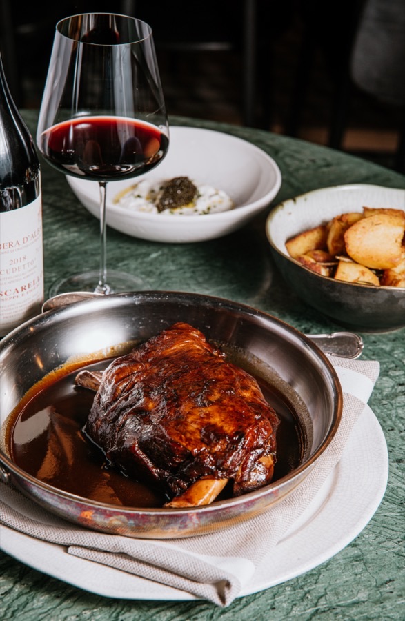18-HOUR SLOW-ROASTED LAMB SHOULDER IN BAROLO WINE WITH AROMATIC HERBS AND TUSCAN POTATOES WITH ROSEMARY AND GARLIC